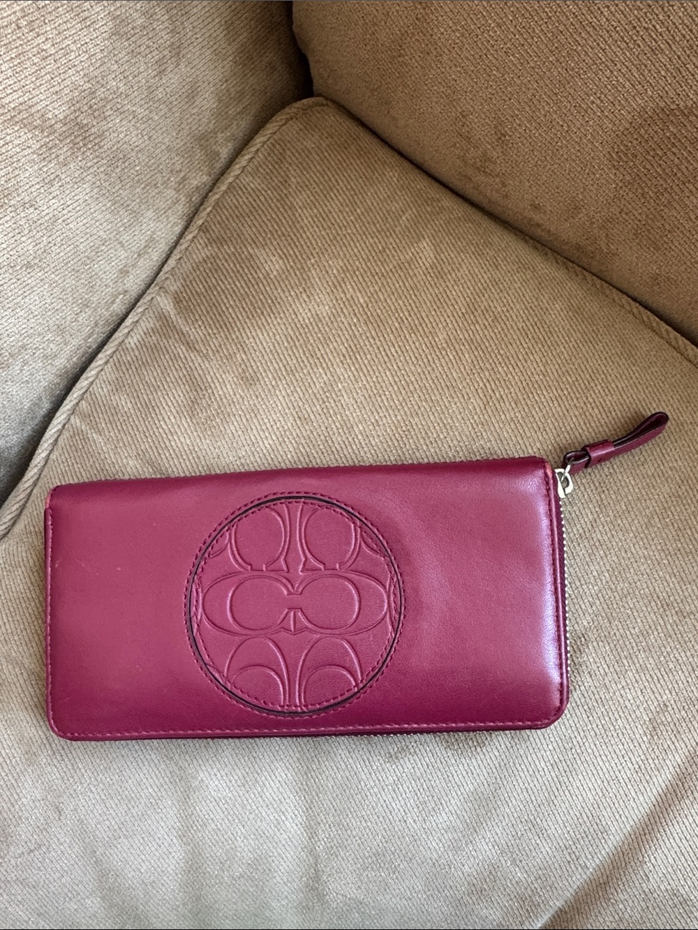 Coach Burgundy Leather Zip-Around Wallet with Embossed Signature Medallion